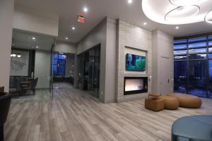 a living room with a fireplace in a building at Houston's Downtown Oasis in Houston