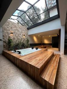 a large room with a bath tub in a building at Luxury - Casa Shangri-la in Medellín