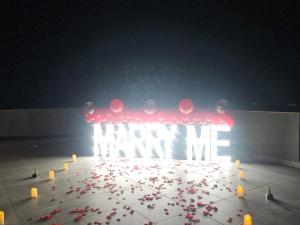 a stage with a bunch of red balloons and lights at Tbilisi Sea Hotel in Tbilisi City