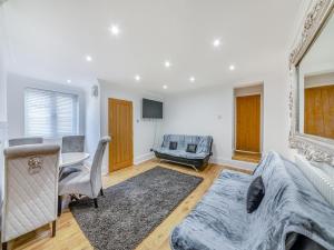 a living room with a bed and a table at Blossom Apartment - Uk45970 in Yarm