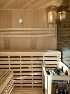 a sauna with a clock on the wall at Großzügige und romantische Wellnessoase mit privater Sauna in ruhiger Lage in Karlsbad