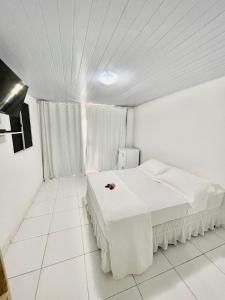 Łóżko lub łóżka w pokoju w obiekcie Terras Verdes Residence