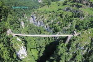 a bridge in the middle of a mountain at Chambres Mendiondo Gaü Eztia in Ossas-Suhare +24 photos