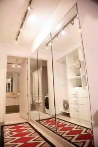 a large mirror in a room with a rug at Chic Miraflores AC HEATER 16th floor in Lima +43 photos