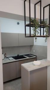a kitchen with a sink and a counter top at Studio Apartment Smile Mostar in Mostar