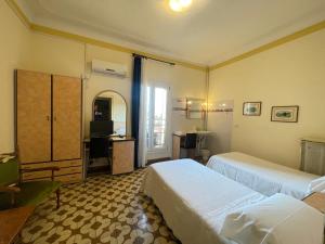 Postel nebo postele na pokoji v ubytování Hotel Panorama Bologna Centro