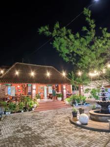 a night view of a patio at a resort at Omah Mbah Manten in Tuntang