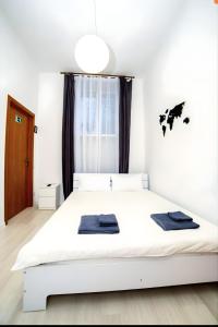 Posteľ alebo postele v izbe v ubytovaní Atlas Hotel