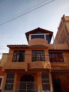 a house with a tower on top of it at Departamento 1 casa Iglesias in Sucre