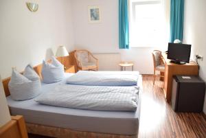 Postel nebo postele na pokoji v ubytování Niebuhrs Hotel