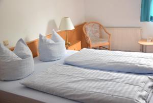 Postel nebo postele na pokoji v ubytování Niebuhrs Hotel