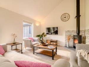 a living room with a couch and a fireplace at 3 Bed in Talybont-on-Usk 88139 in Talybont