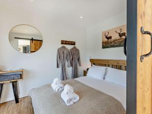 a bedroom with a bed with towels on it at 1 Bed in Worcestershire 89032 in Abberley