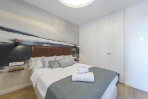 Letto o letti in una camera di GRAN VIA capitals by MONARO*****