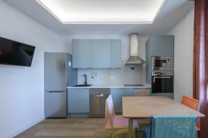 Cucina o angolo cottura di GRAN VIA capitals by MONARO*****