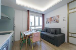 Area soggiorno di GRAN VIA capitals by MONARO*****