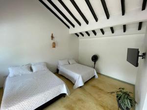Postel nebo postele na pokoji v ubytování Hacienda La Pola