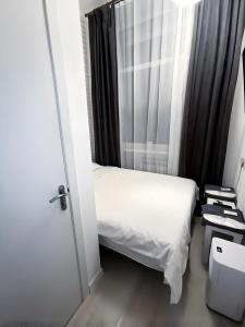Posteľ alebo postele v izbe v ubytovaní Atlas Hotel