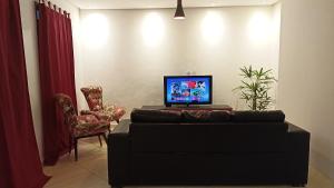 TV a/nebo společenská místnost v ubytování Casa Moriá