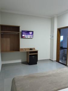 TV a/nebo společenská místnost v ubytování Pousada Vivenda + 7 fotografií