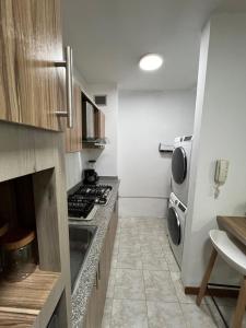 Kuchyň nebo kuchyňský kout v ubytování Apartamento Diagonal a Hesperia y Dunas