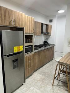 Kuchyň nebo kuchyňský kout v ubytování Apartamento Diagonal a Hesperia y Dunas