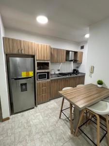 Kuchyň nebo kuchyňský kout v ubytování Apartamento Diagonal a Hesperia y Dunas