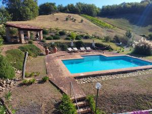 a swimming pool in the middle of a yard at Luxury Villa with Pool, Stunning Location in San Ginesio