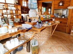 a kitchen with a counter with plates and bowls at Santa Maria Pucon in Pucón