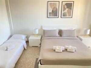 Ένα ή περισσότερα κρεβάτια σε δωμάτιο στο Casa Relax con Parcheggio e Metro