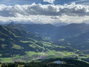 an aerial view of a town in a valley with mountains at For 2 in Hopfgarten im Brixental