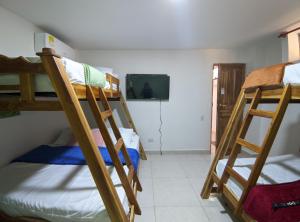 a room with three bunk beds in a room at Hotel Dreimar in Cartagena de Indias