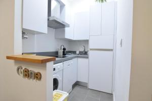 A kitchen or kitchenette at Apartamento Atarazanas Málaga Centro Histórico