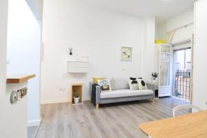 A bed or beds in a room at Apartamento Atarazanas Málaga Centro Histórico