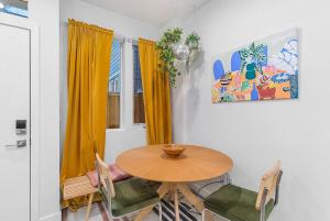 a dining room with a wooden table and chairs at Cozy Oasis in the heart of Capitol Hill in Seattle