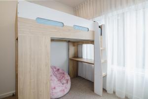 a bedroom with a bunk bed with a bunk bed frame at Beachside Mornington house in Mornington