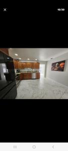 a large room with a kitchen with a counter top at Villa hermosa in Key Largo