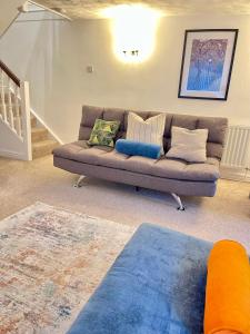a living room with a couch and a rug at Mount Yard - Stylish Cottage - Close to Alton Towers - Water World -Stoke-on-Trent Sleeps 5 in Totmonslow