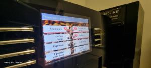 a television screen on a wall in an oven at Elstree Inn in Borehamwood