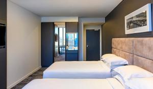 Posteľ alebo postele v izbe v ubytovaní Four Points by Sheraton Auckland