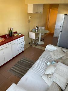 a kitchen with a couch and a table in a room at Habitación en Concon y área compartida in Concón