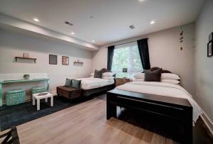 a large bedroom with a bed and a couch at Artsy Hidden Gem ll -Free Parking --- in Philadelphia