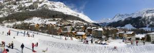 a group of people standing on a snow covered mountain at Haus Valesia in Leukerbad