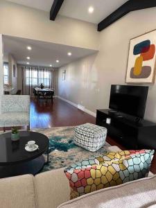 a living room with a couch and a table at Vacation paradise in St. Catharines