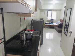 Ένα ή περισσότερα κρεβάτια σε δωμάτιο στο Brenthill Condo