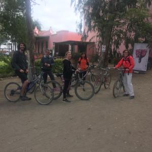 a group of people standing next to their bikes at Ica adventures out of the woods in Ica