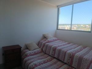 Postel nebo postele na pokoji v ubytování Lindo y acogedor departamento.