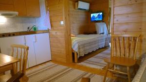 Ένα ή περισσότερα κρεβάτια σε δωμάτιο στο Matkailutila Lahdelma