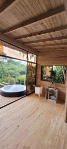 a large room with a bed and large windows at Kuyana Glamping in Cali