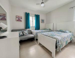 Krevet ili kreveti u jedinici u okviru objekta Goistay Luxurious Goistay Oasis in Juan Dolio Your Seaside Sanctuary